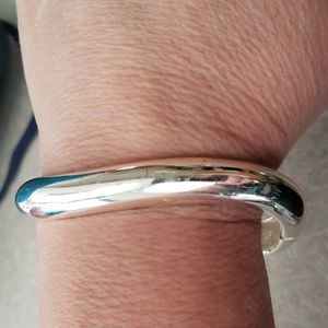 Silver tone bent shape hinge bangle bracelet